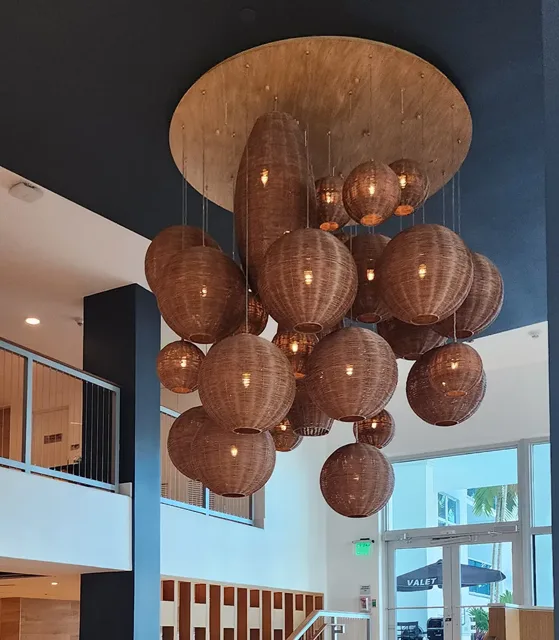 Cluster of warm pendant lights suspended from a ceiling