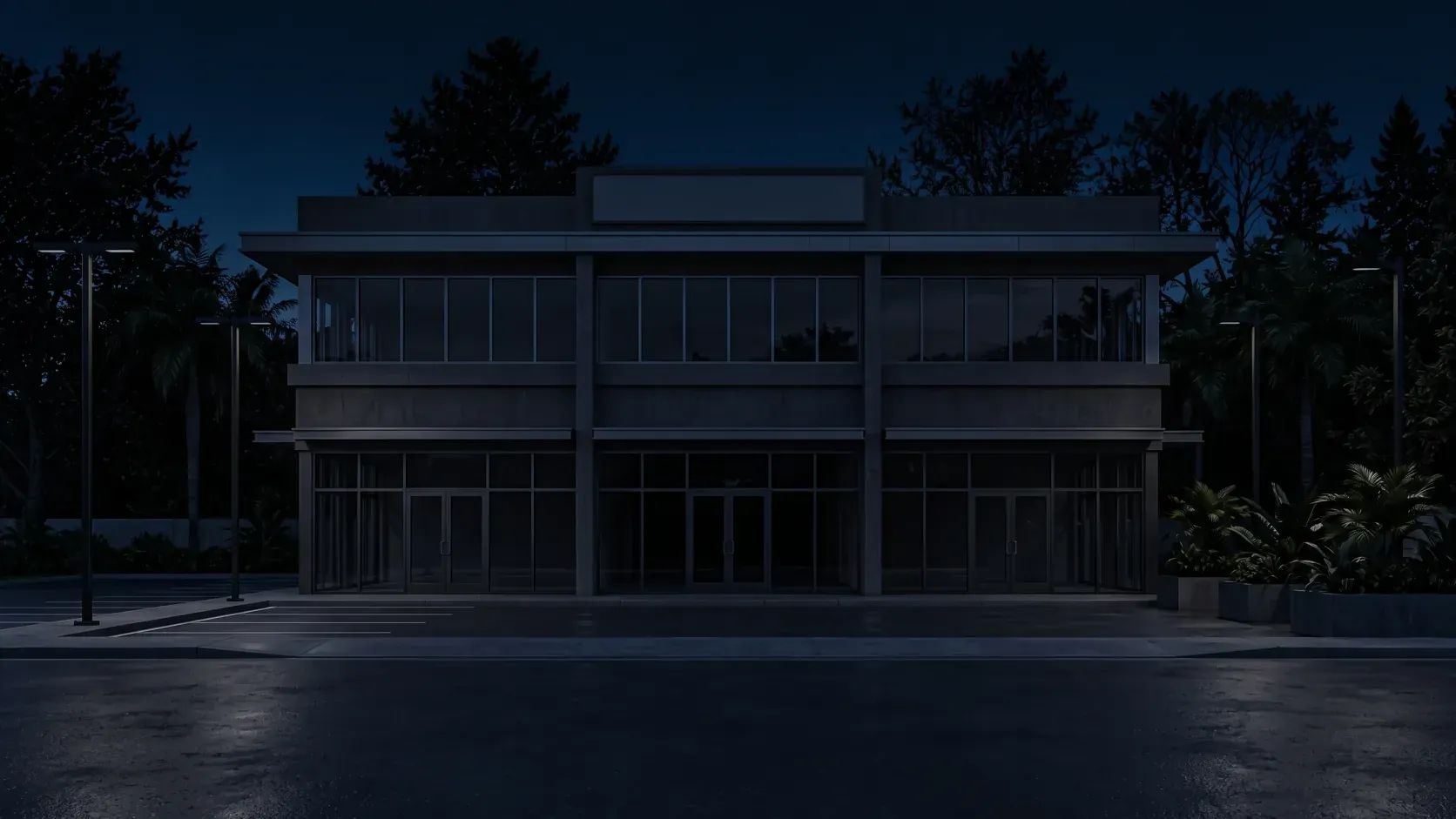 Two-story commercial building at night with its lights turned off